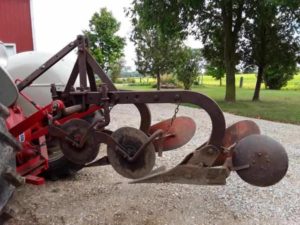 10 inch Bantam plow mount on a Ford 8N A 2 bottom plow mounted on an antique tractor