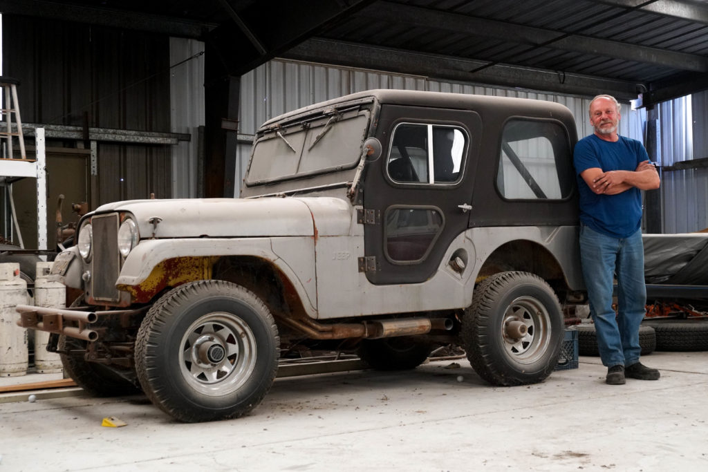 Man standing by his Jeep