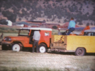 Red Jeep and yellow truck