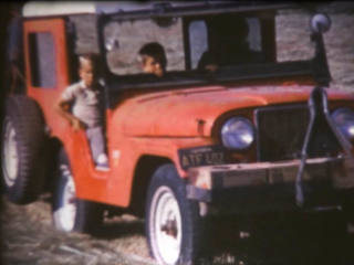 Jeep driven by women with two young boys