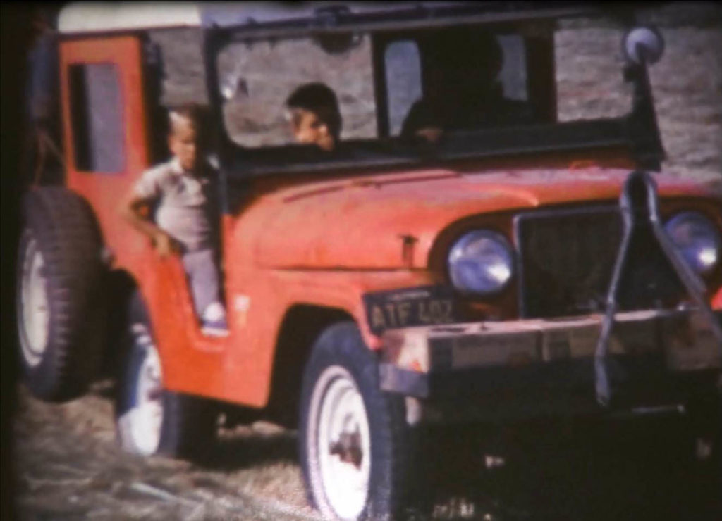 Jeep driven by women with two young boys